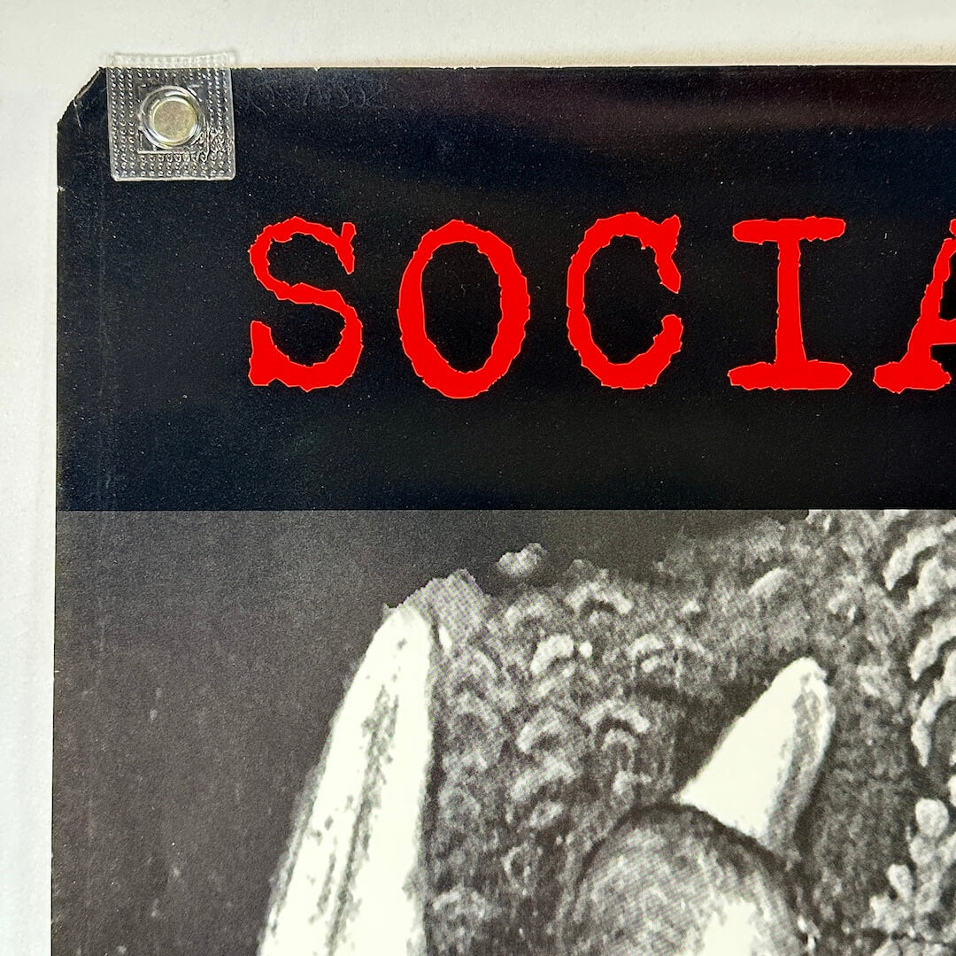 Top left corner with tear to corner. 