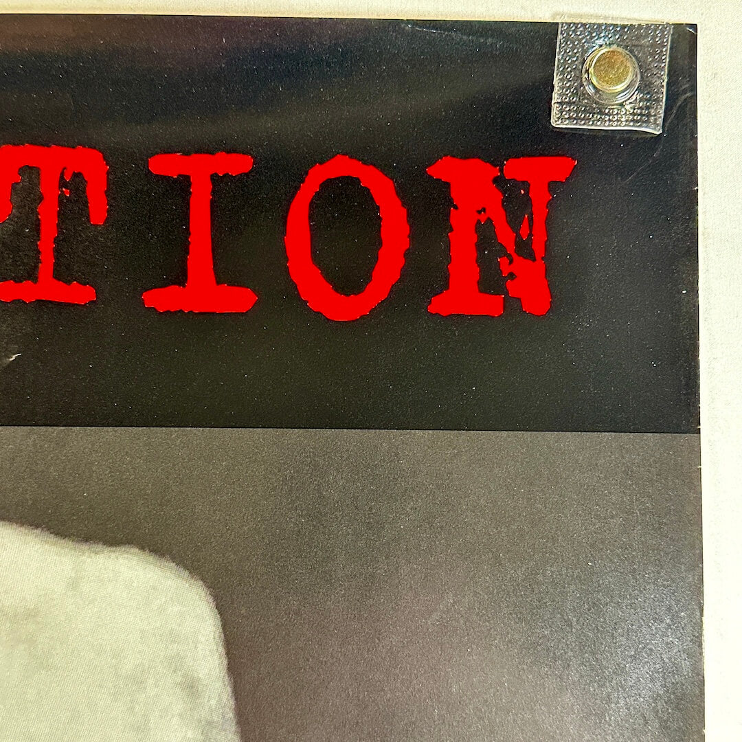 Top right corner with slight scratch. 