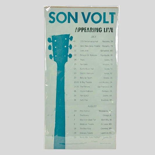 Son Volt tour poster wrapped in plastic against white background. 