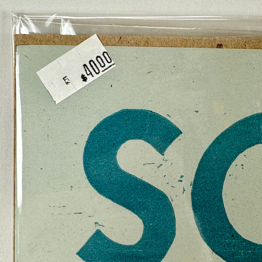 Top left corner of poster with crisp corner and clean edges. 