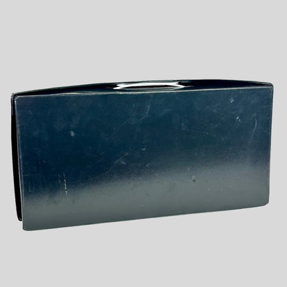 Blue leather-like case with visible wear on a white background