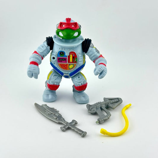 TMNT turtle action figure with accessories on white background. 