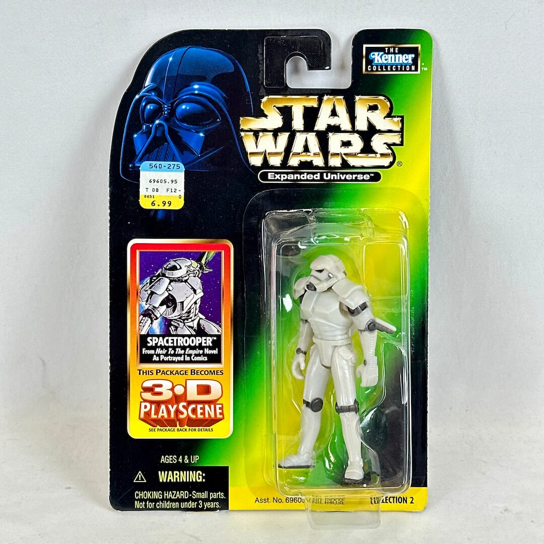 Star Wars toy figure in packaging with Darth Vader helmet on a white background