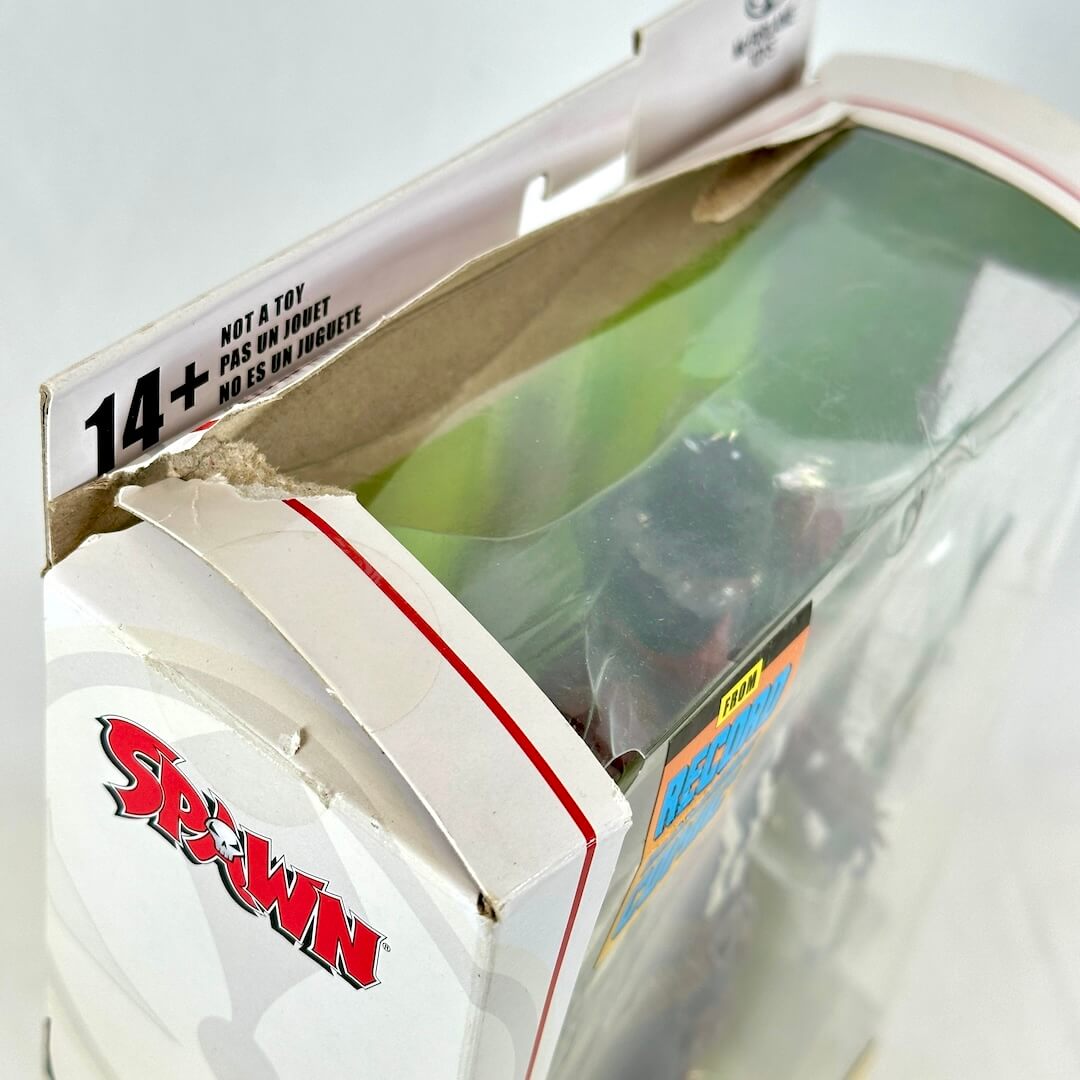 Close-up of wear to top of packaging. 