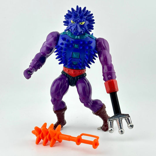 Action figure with blue spikes covering chest and head, and purple arms and legs. 
