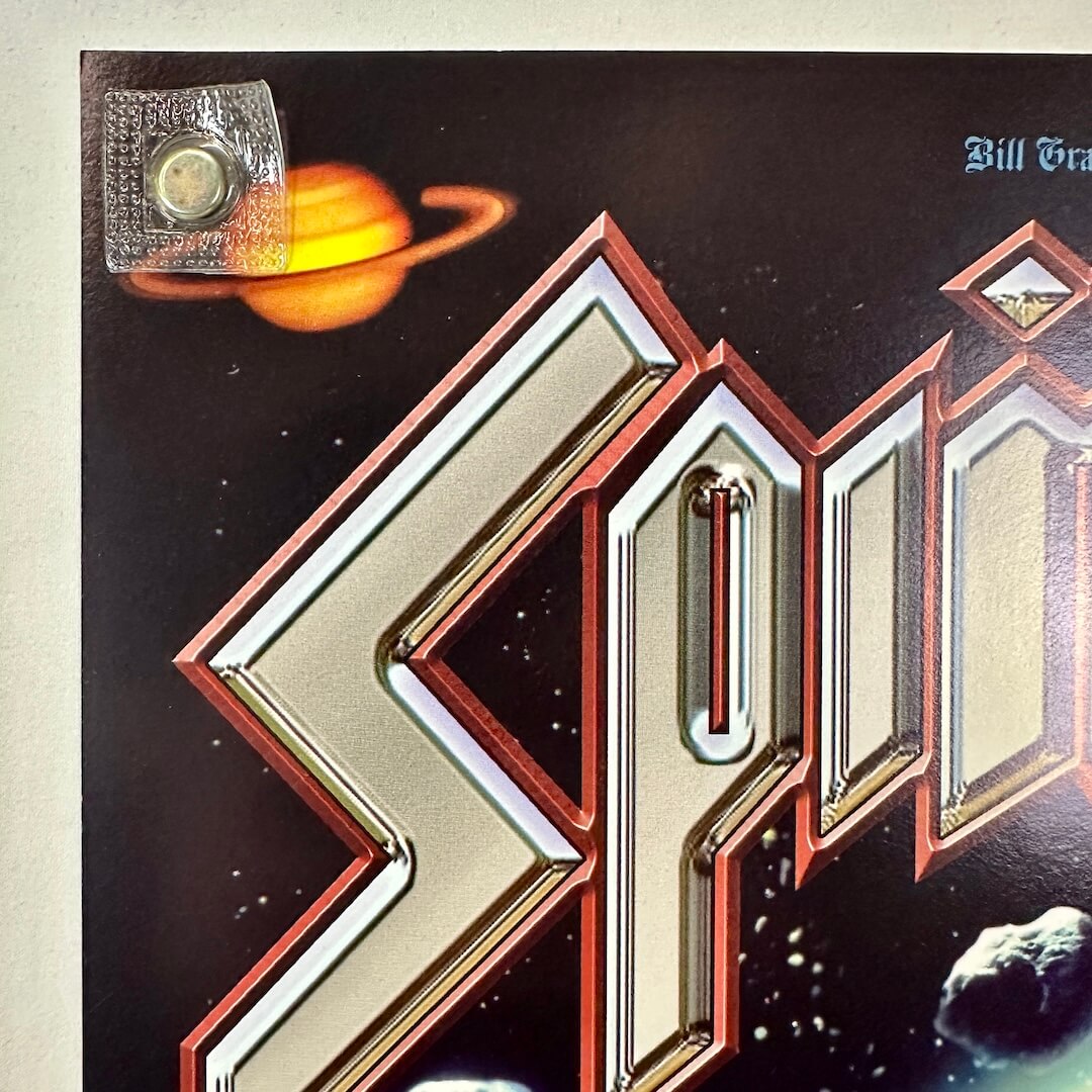 Top left corner of poster with crisp corner and clean edges.