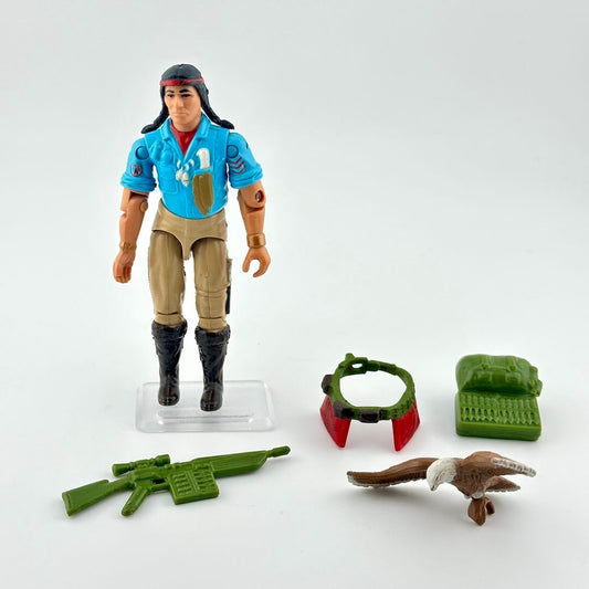 GI Joe action figure with accessories on white background. 