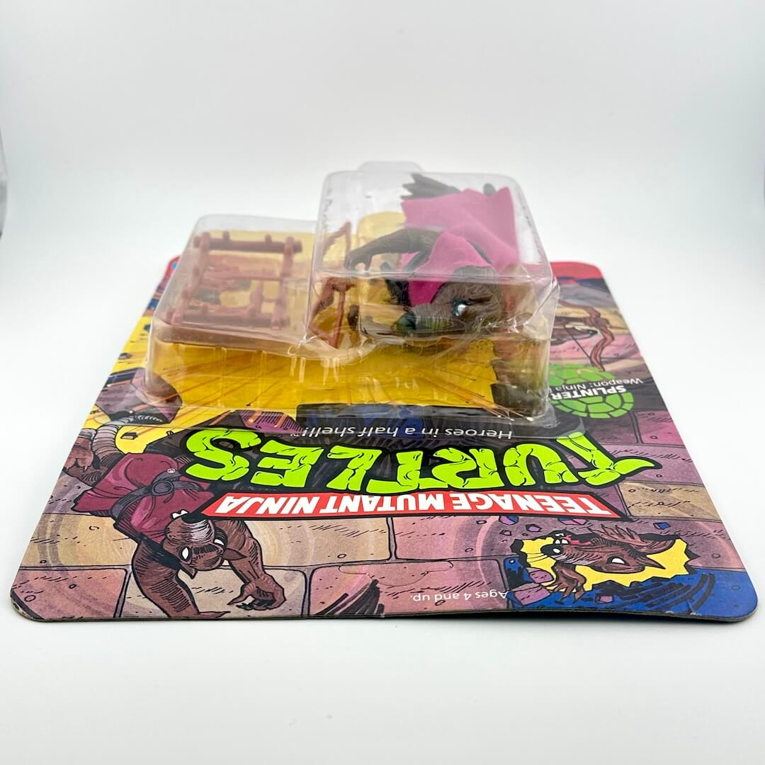 Toy figure in packaging with Teenage Mutant Ninja Turtles theme.