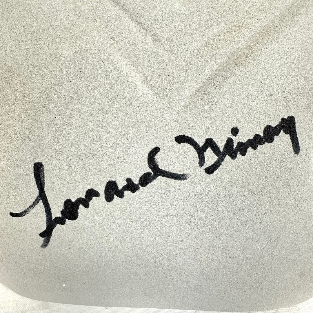 Signature on a textured white background