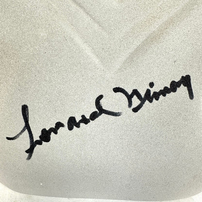 Signature on a textured white background
