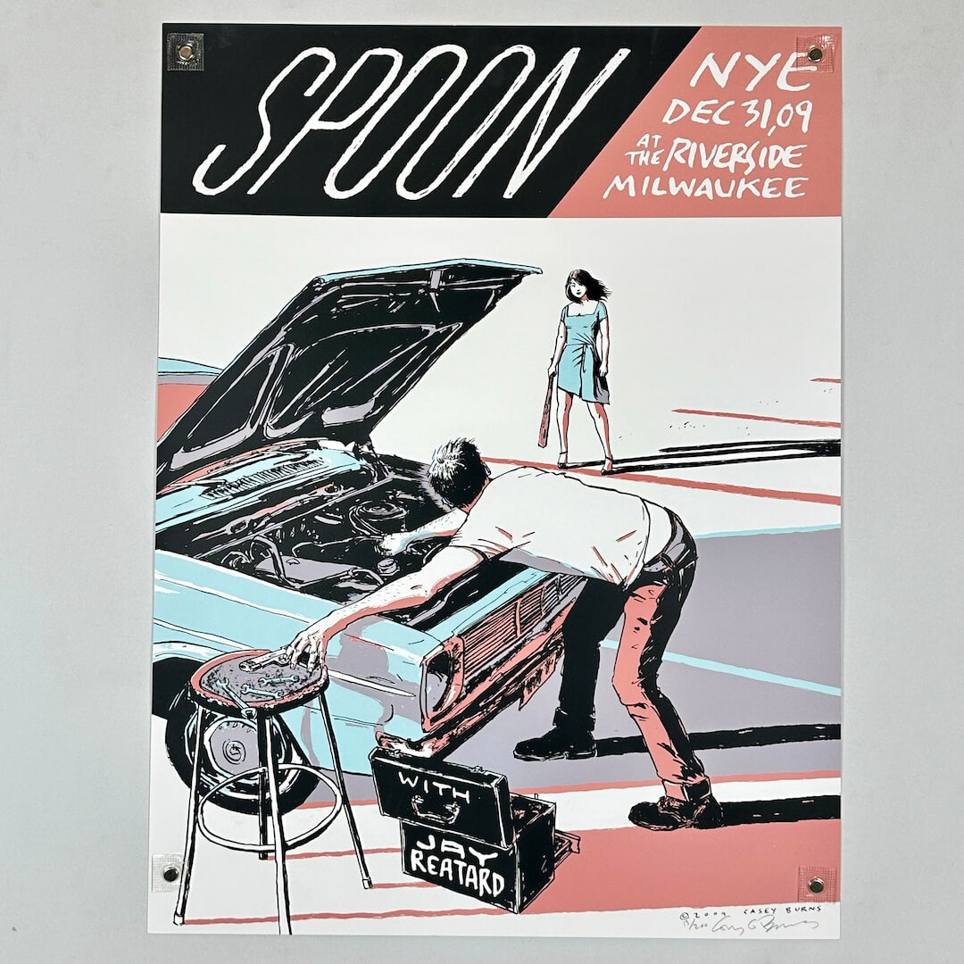 Concert poster with man standing in front of car with hood up, and woman approaching with bat. Text along top. 