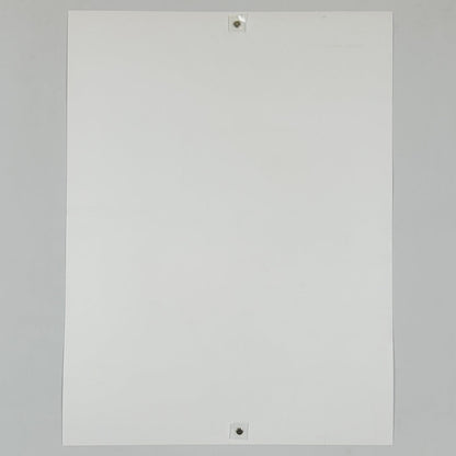 Backside of white poster against white background. 