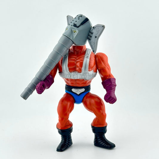 Action figure with man body and elephant head wearing orange bodysuit. 