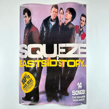 Promotional poster for Squeeze's 'East side Story' album with band members on a purple background.