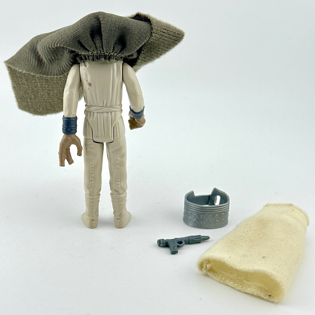 Sci-fi franchise action figure with accessories against white background. 