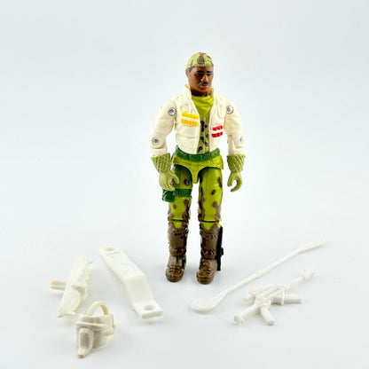 Vintage action figure with accessories on a white background