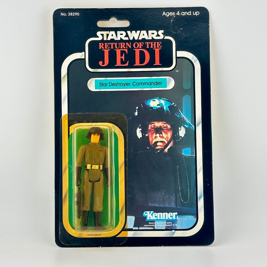 Vintage Star Wars action figure in packaging on a white background