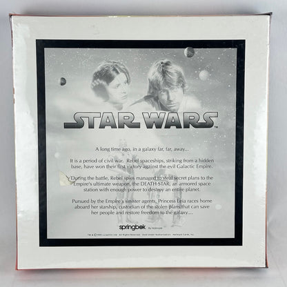 Star Wars packaging with characters and text on a gray background