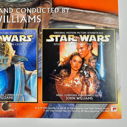 Two 'Star Wars' movie soundtracks with characters from the series on an orange background.