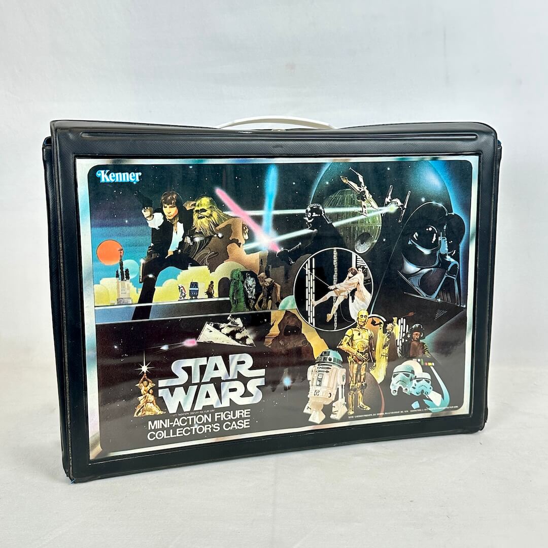 Vintage Star Wars action figure collector's case with character illustrations on a white background