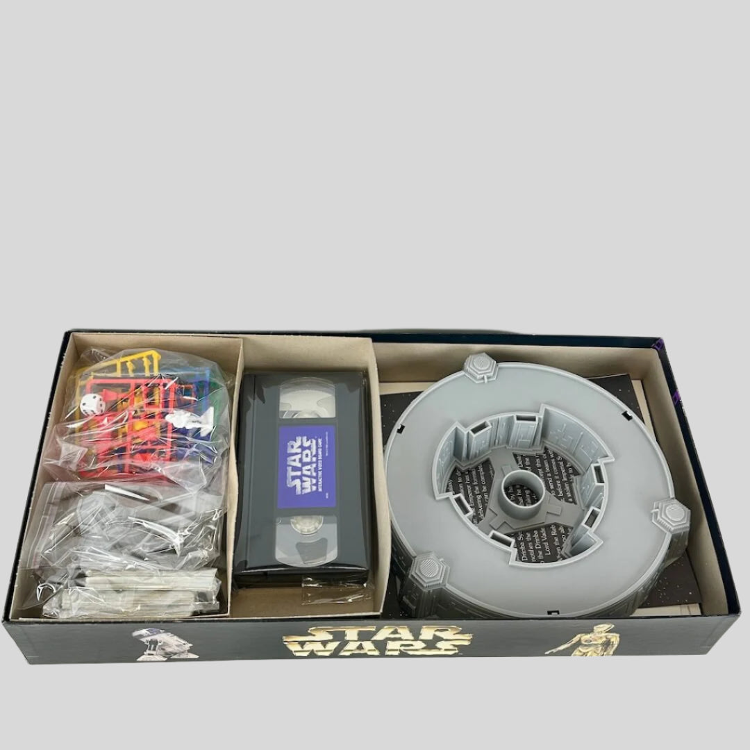Star Wars toy set with various components in an open box on a white background