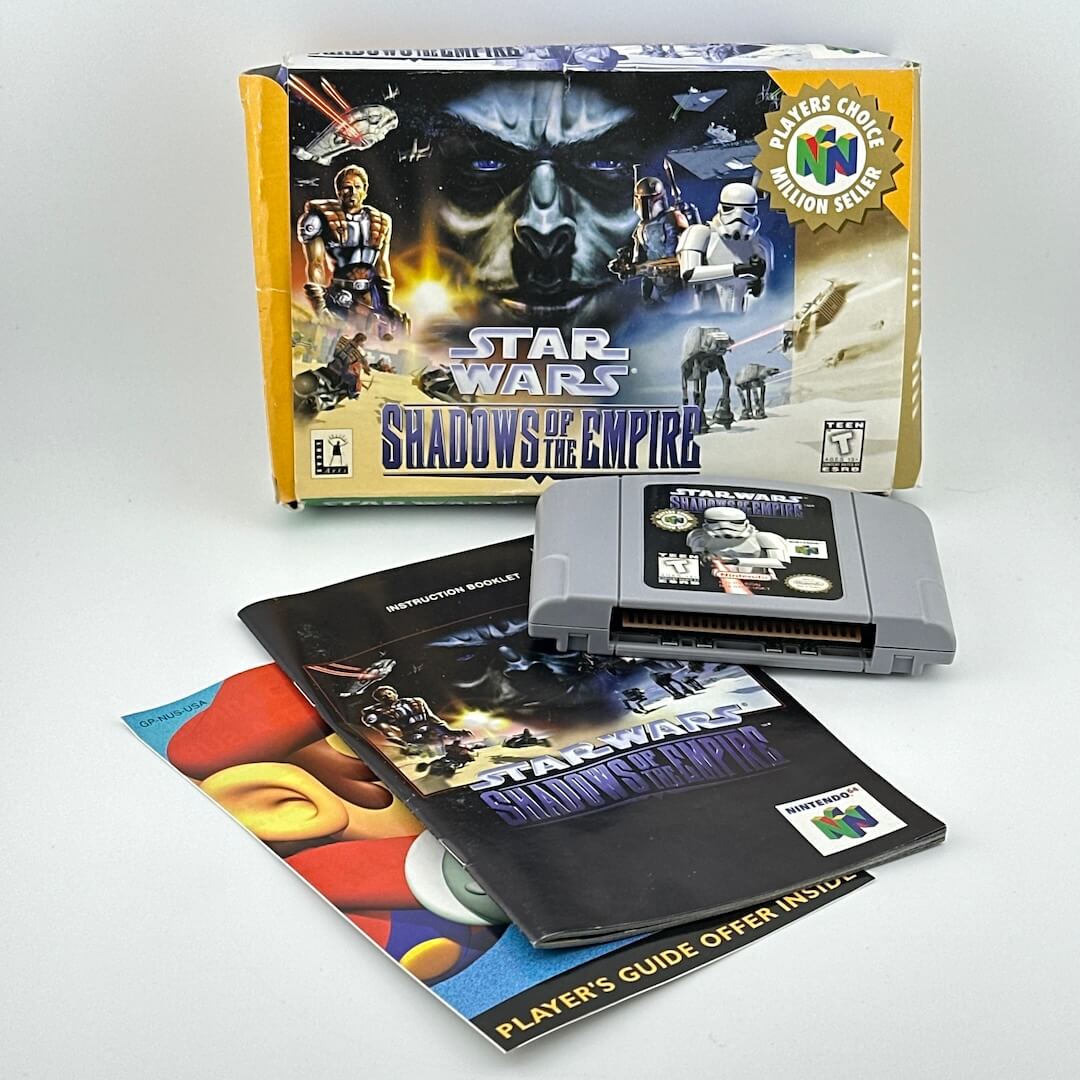 Star Wars: Shadows of the Empire game for N64 with packaging and manual on a white background