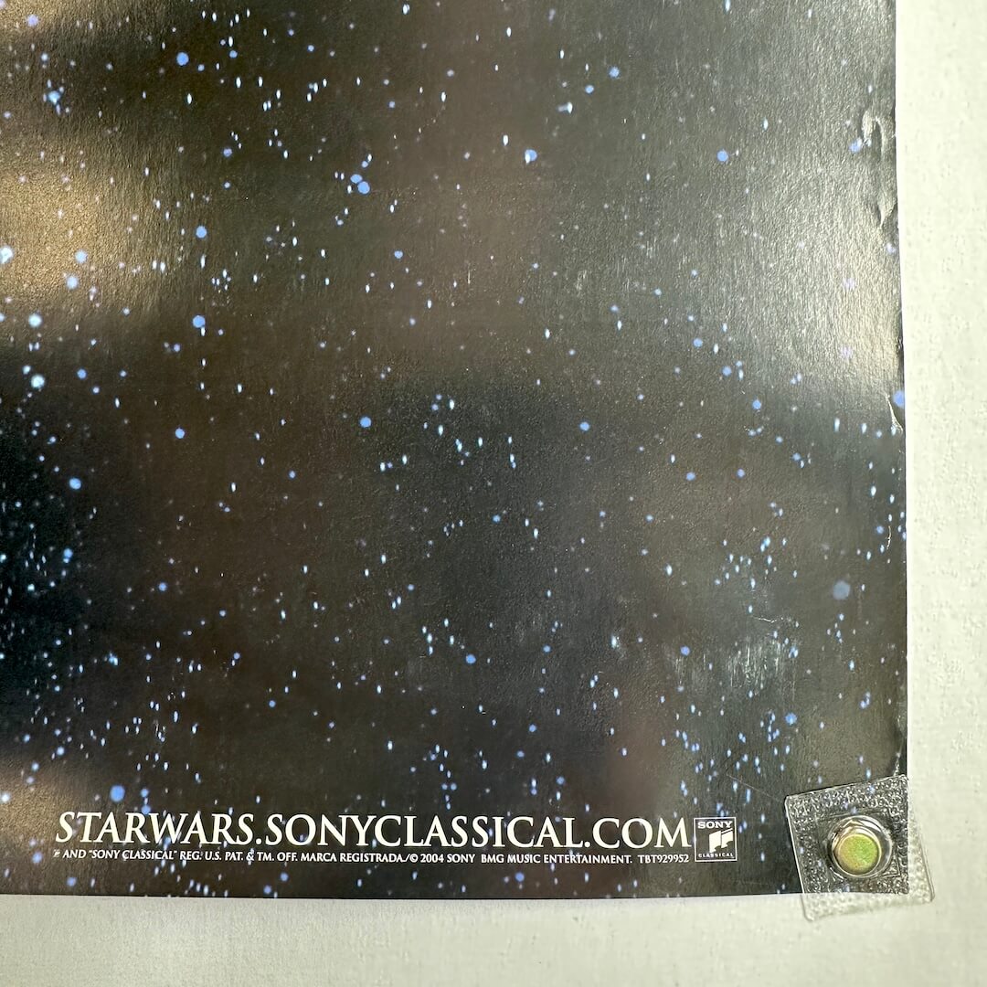 Bottom right corner of poster with copyright information and showing edge wear. 