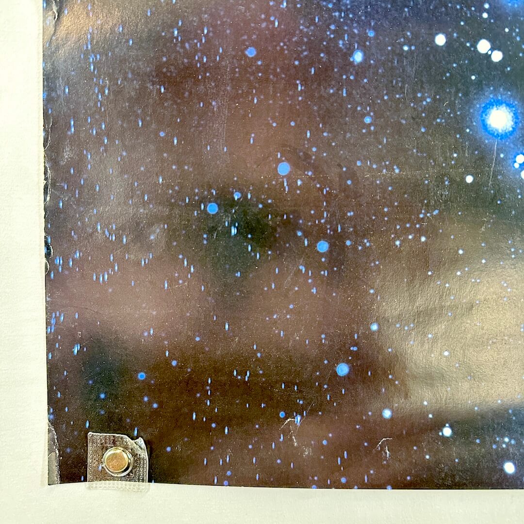 Bottom left corner with wear to edge and some creases.