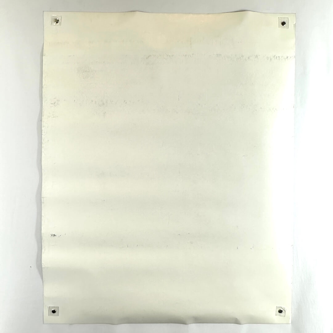 Backside of poster showing some scuffing to face and edge wear throughout. 