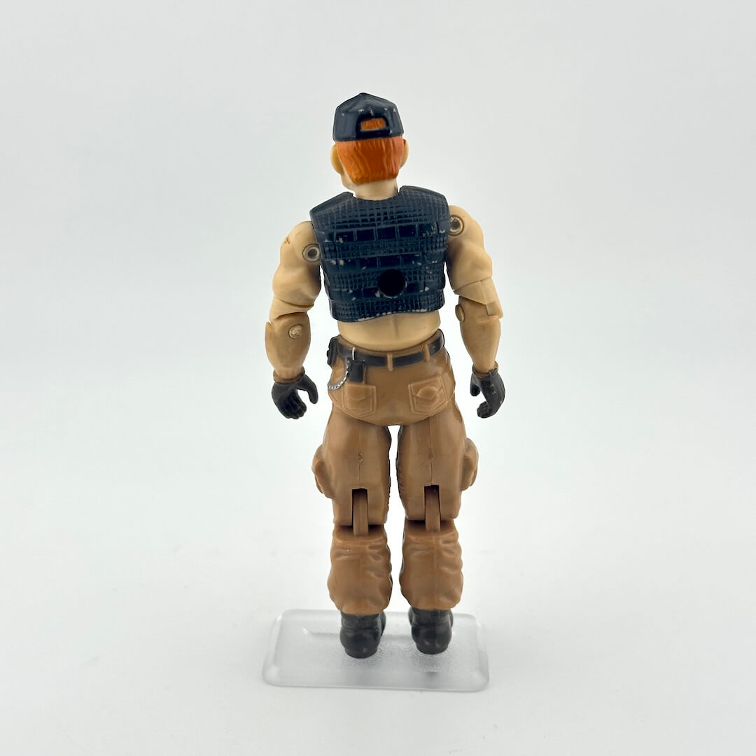 Action figure in tactical gear on a white background