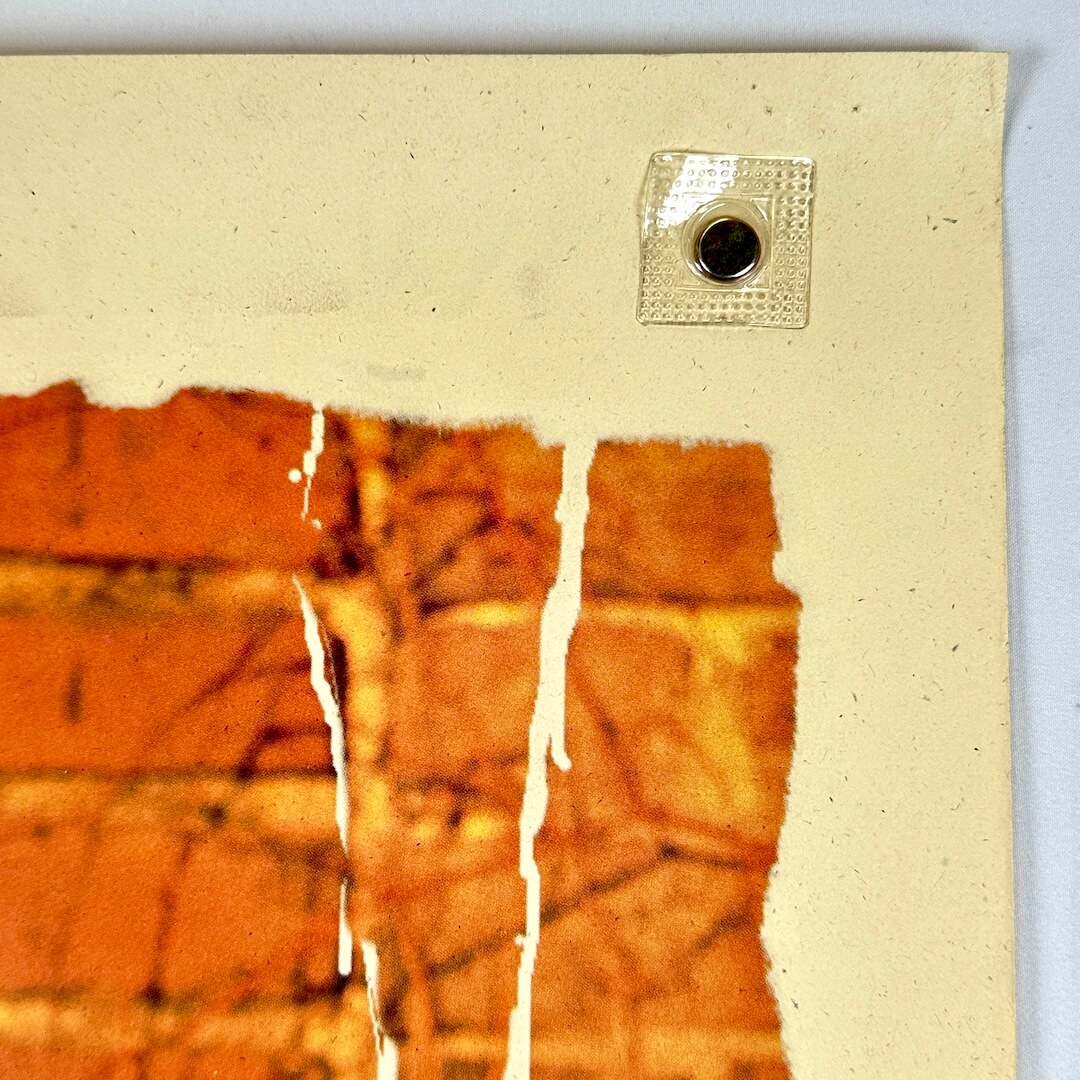 Top right corner of poster with no obvious damage.