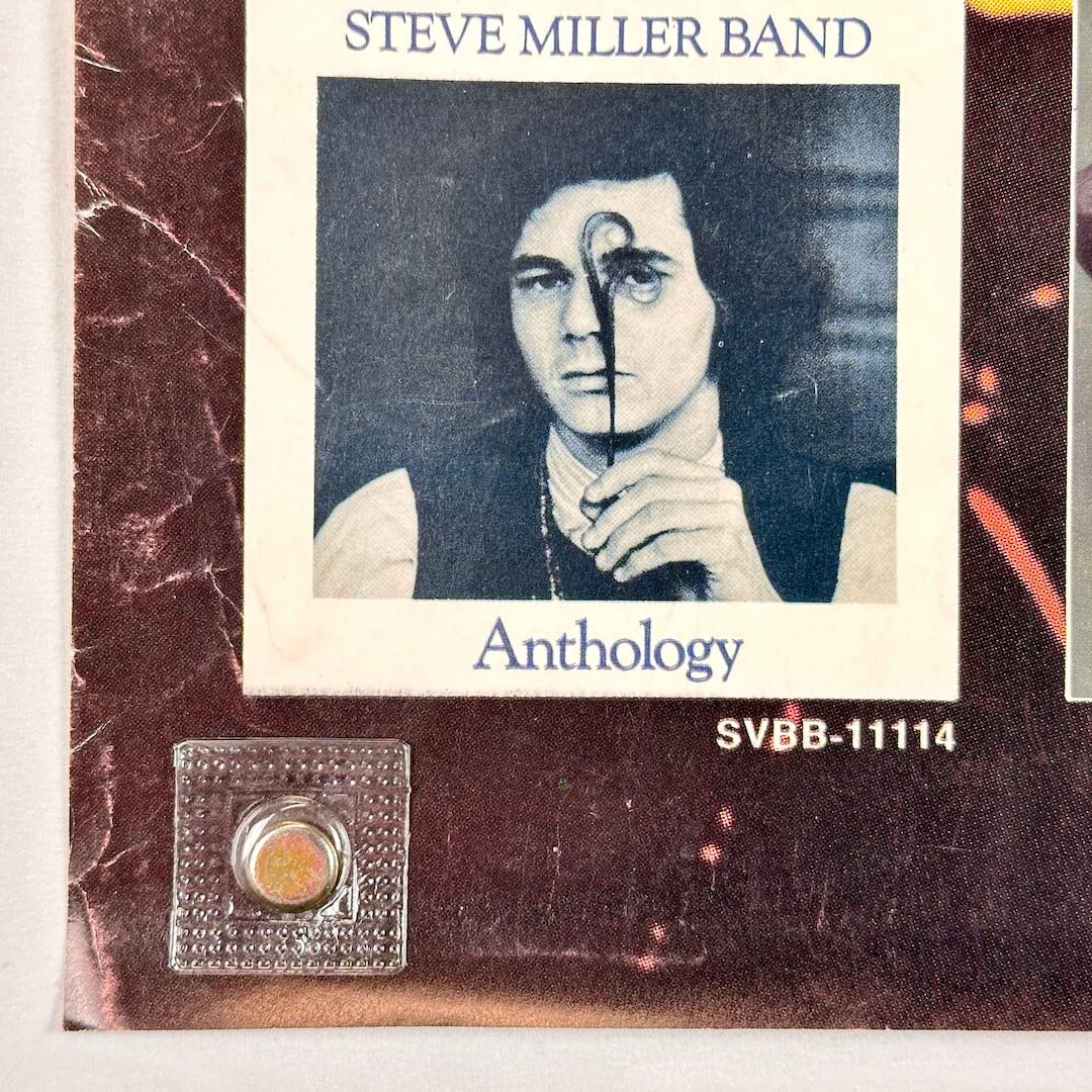 Bottom left corner with edge wear and creasing. 