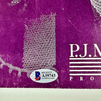 Silver Beckett Authenticity sticker on purple poster. 