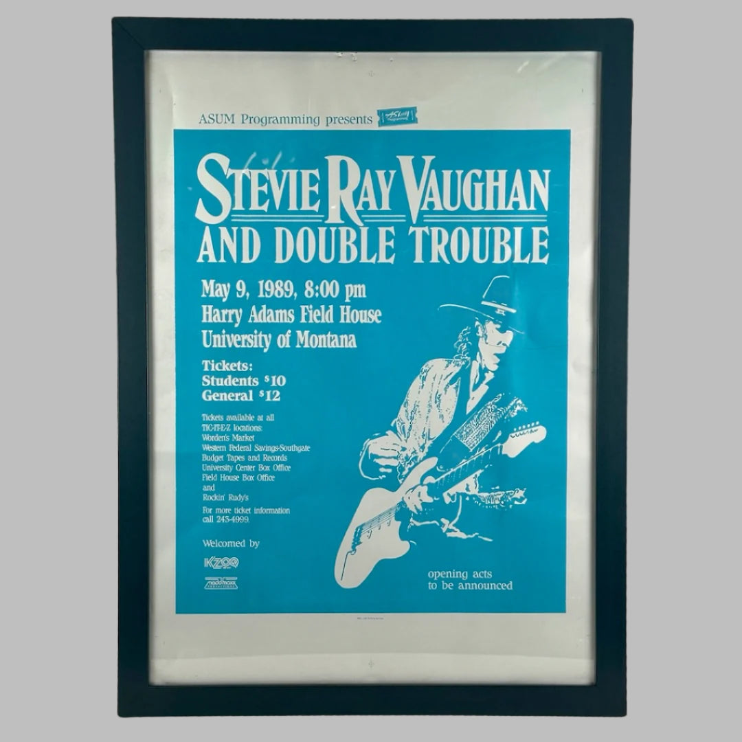 Black frame with blue press plate for Stevie Ray Vaughan 1981 MT show. White text along left white silhouette of SRV at right