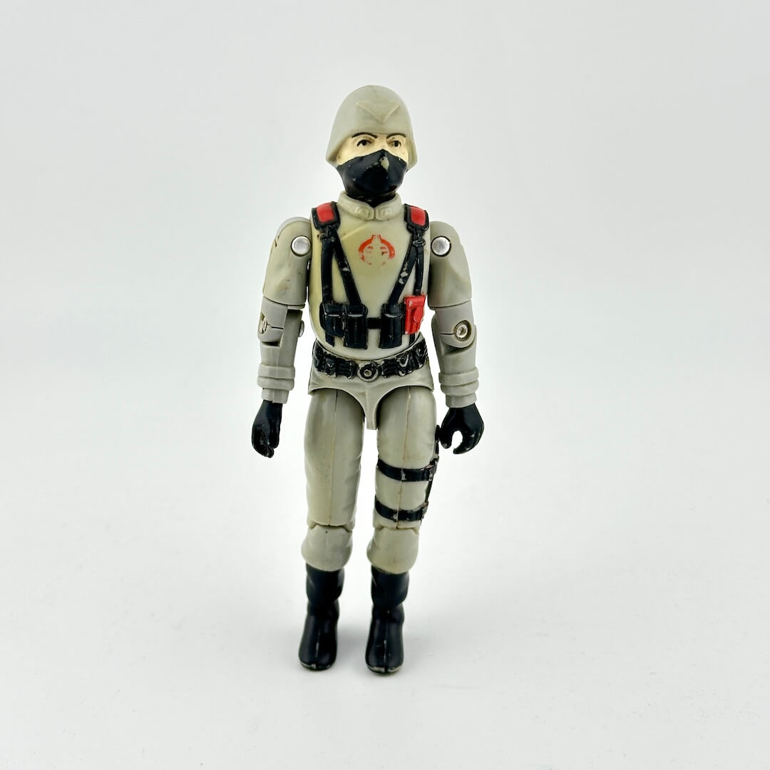 Action figure in a gray suit with black mask on a white background