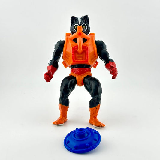 black and white toy action figure with skunk-like features in orange armor with blue shield. 