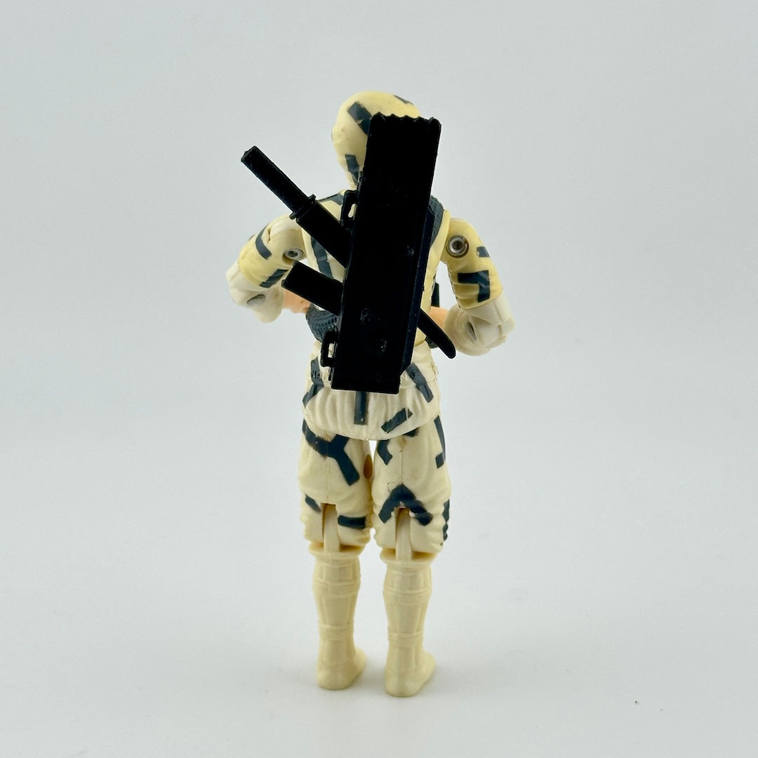 Back of white male action figure in white camo with black details, pictured with black backpack with sword.