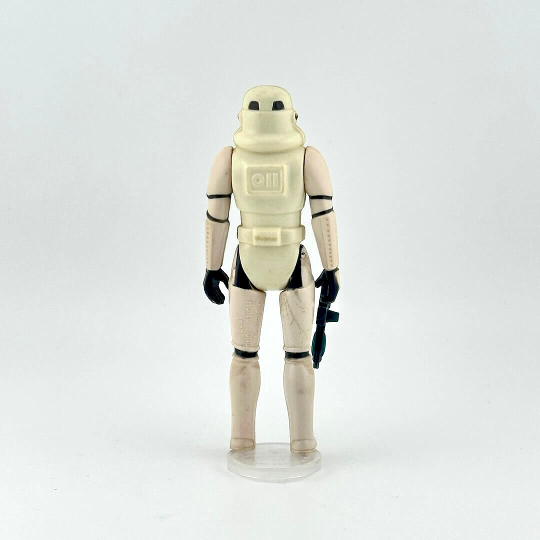 Toy figure of a stormtrooper in white armor on a white background
