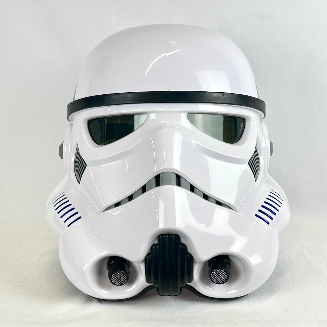 A glossy white Stormtrooper-style helmet photographed against a plain light gray background.