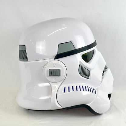 A glossy white stormtrooper-style helmet photographed from the side against a plain light gray background.