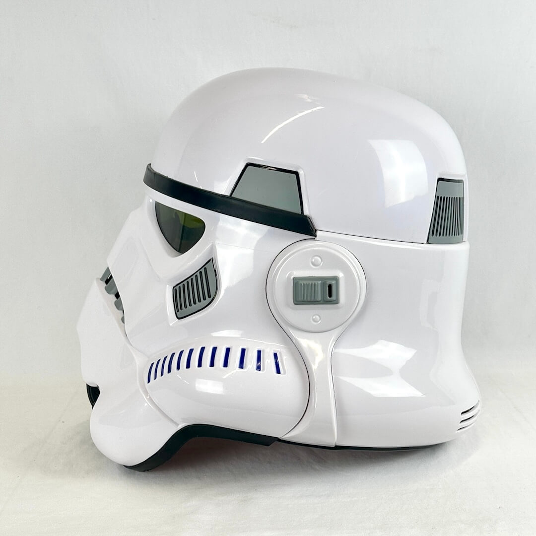 A glossy white Stormtrooper helmet replica, shown from the side on a light gray background.