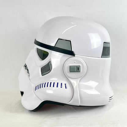 A glossy white Stormtrooper helmet replica, shown from the side on a light gray background.