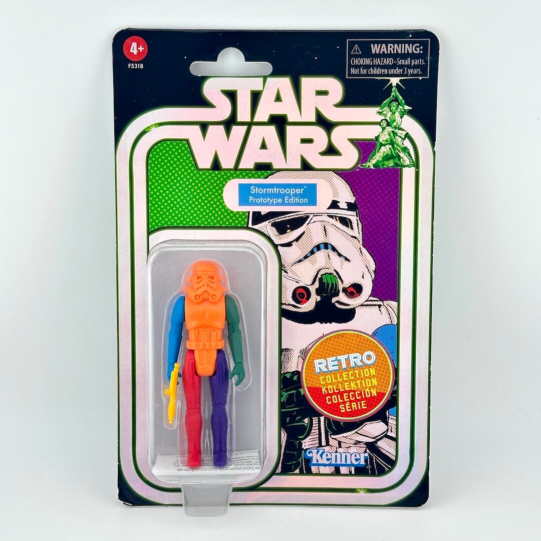 Star Wars Stormtrooper action figure with various colored body parts still sealed in original blister packaging. 