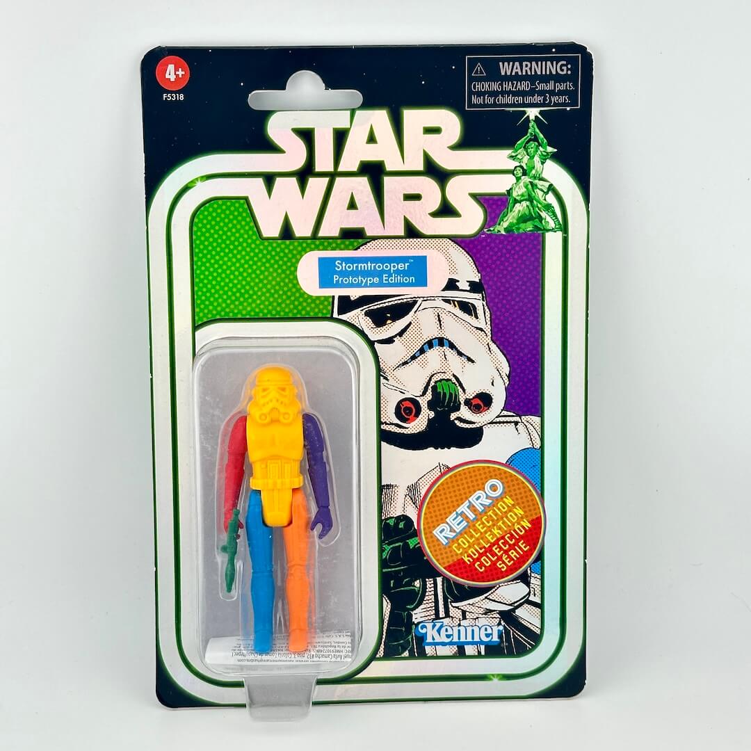Star Wars Stormtrooper action figure with various colored body parts still sealed in original blister packaging. 