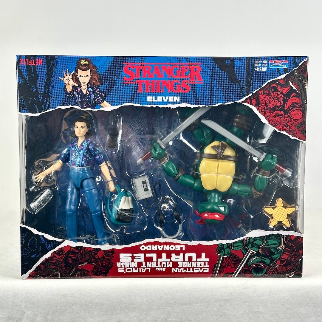 A boxed action figure set featuring a Teenage Mutant Ninja Turtles Eleven figure and a Leonardo figure in retail packaging.