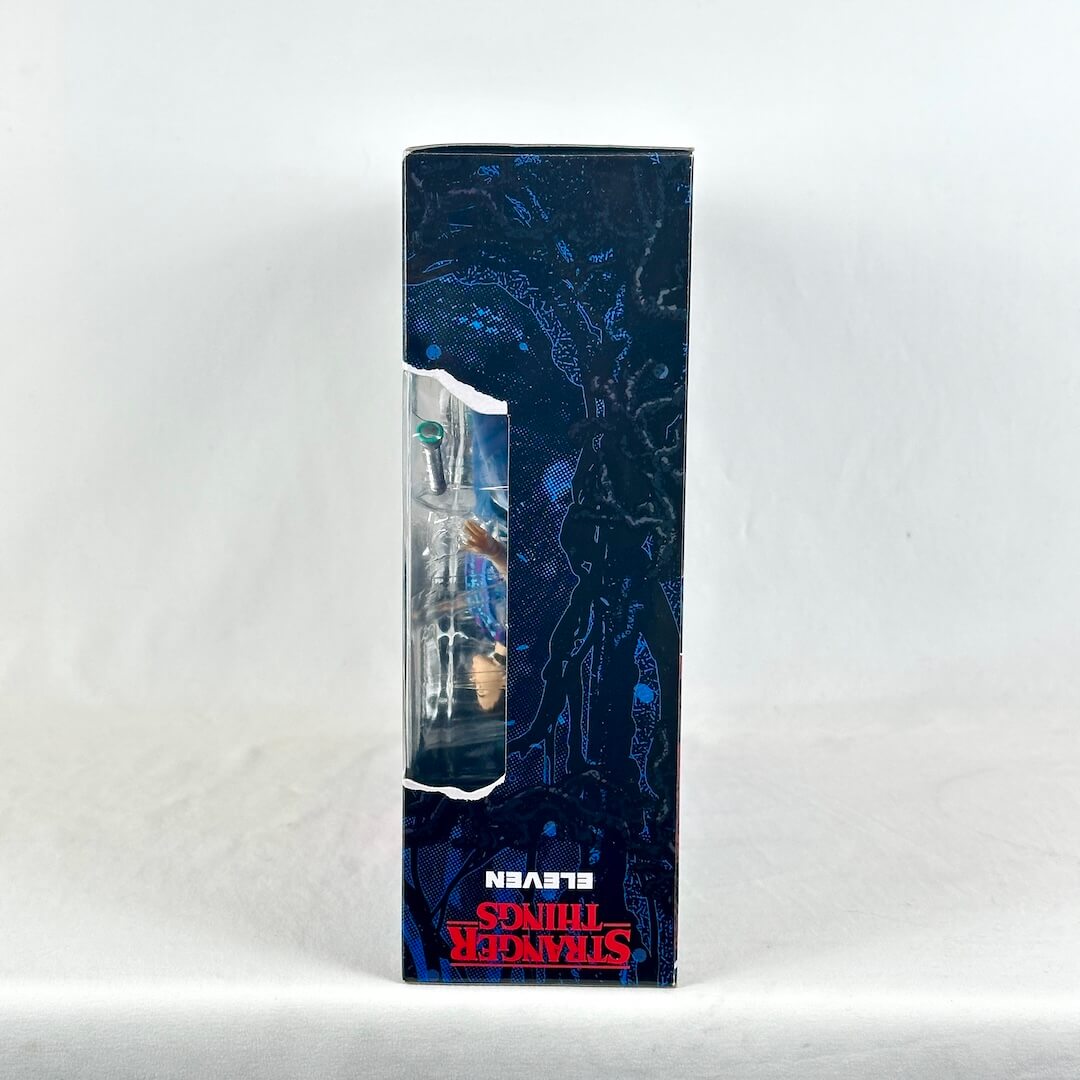 Side view of action figure packaging with Stranger Things branding. 