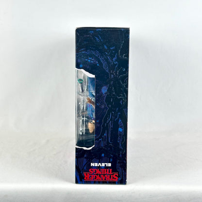Side view of action figure packaging with Stranger Things branding. 