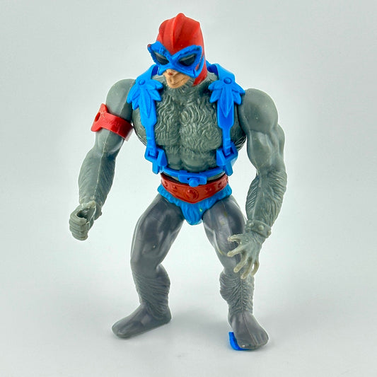Grey monkey-man figure with blue loincloth & harness, with red belt, helmet & armband.