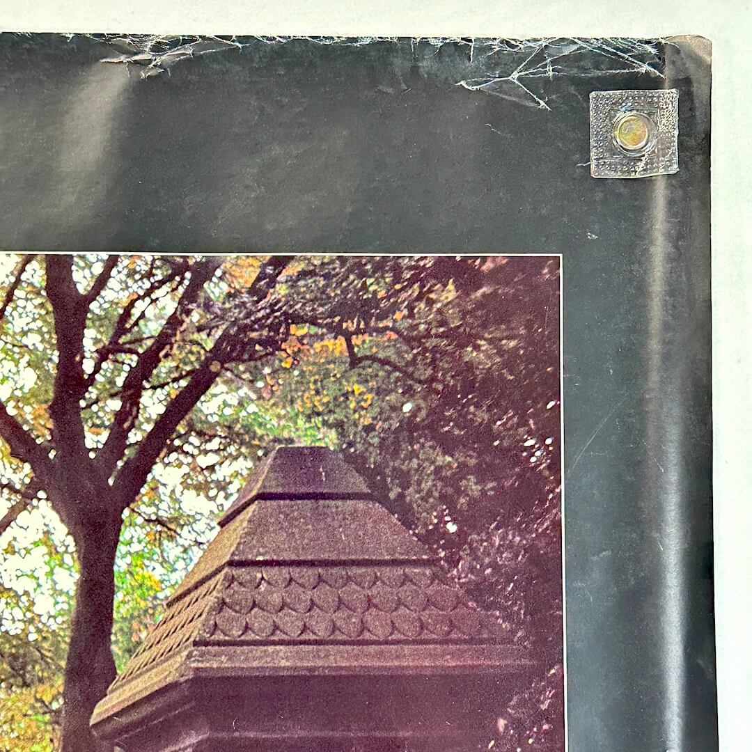 Top right corner of poster with wear and creases to top edge. 