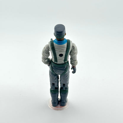 Action figure in a gray and green suit on a white background